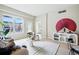 Bright living room featuring modern decor, hardwood floors, and large windows with neighborhood views at 1975 N Grant St # 810, Denver, CO 80203