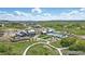 Community clubhouse and pool area from the air at 2105 Bellcove Dr, Castle Pines, CO 80108
