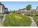 Backyard featuring a well-maintained lawn, garden beds and a privacy fence at 2105 Bellcove Dr, Castle Pines, CO 80108