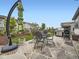 Backyard patio featuring a large table with an umbrella and a grill at 2105 Bellcove Dr, Castle Pines, CO 80108
