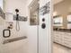 Contemporary shower featuring sleek tiling, a built-in bench, and a modern showerhead at 2105 Bellcove Dr, Castle Pines, CO 80108