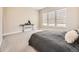 Bright bedroom featuring large windows with modern shades and soft carpet at 2105 Bellcove Dr, Castle Pines, CO 80108