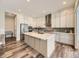 Modern kitchen with a large island, stainless steel appliances, and ample cabinet space at 2105 Bellcove Dr, Castle Pines, CO 80108