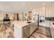 Gourmet kitchen showcasing a center island, modern appliances, and an open layout at 2105 Bellcove Dr, Castle Pines, CO 80108