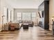 Comfortable living room featuring a modern fireplace, large sectional sofa, and natural light at 2105 Bellcove Dr, Castle Pines, CO 80108