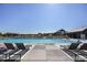 Community pool featuring ample seating and lounge chairs at 2105 Bellcove Dr, Castle Pines, CO 80108