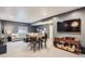 Finished basement features a comfortable seating area and bar, perfect for entertaining guests at 286 Western Sky Cir, Longmont, CO 80501