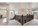 Upstairs hallway area with neutral walls, carpeted floors, and natural light from windows on either side at 286 Western Sky Cir, Longmont, CO 80501