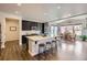 Modern kitchen with stainless steel appliances, dark cabinets, and a spacious island at 286 Western Sky Cir, Longmont, CO 80501