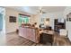 Comfortable living room with hardwood floors, large windows, and neutral paint at 286 Western Sky Cir, Longmont, CO 80501