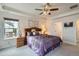 Spacious main bedroom with a ceiling fan, neutral paint, and carpeted floors at 286 Western Sky Cir, Longmont, CO 80501