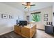 Home office with laminate floors, a ceiling fan, and natural light at 286 Western Sky Cir, Longmont, CO 80501