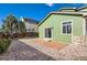 Backyard view featuring a patio, low-maintenance rock landscaping and green siding at 10117 Wyandott N Cir, Thornton, CO 80260