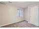 Unfurnished basement with a carpeted floor, window, and white trim work at 10117 Wyandott N Cir, Thornton, CO 80260