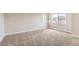 Bright and airy carpeted bedroom filled with natural light from multiple windows at 10117 Wyandott N Cir, Thornton, CO 80260