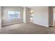 Spacious bedroom with neutral carpet leading to an ensuite bathroom at 10117 Wyandott N Cir, Thornton, CO 80260