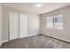 Bedroom featuring closet with sliding doors and window at 10117 Wyandott N Cir, Thornton, CO 80260