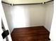 Walk-in closet with hardwood floors and rod for hanging clothes at 10117 Wyandott N Cir, Thornton, CO 80260