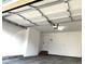 Spacious two-car garage featuring an automatic door and direct access to the home interior at 10117 Wyandott N Cir, Thornton, CO 80260