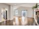 Spacious living room with vaulted ceilings, hardwood floors, and access to the backyard at 10117 Wyandott N Cir, Thornton, CO 80260