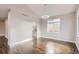 Open living room featuring hardwood floors and large windows at 10117 Wyandott N Cir, Thornton, CO 80260