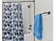 Bathroom featuring a tub and shower with a black and white shower curtain at 4100 Albion St # 314, Denver, CO 80216