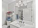 Bright bathroom with single sink, a large mirror and a shower/tub combo at 4100 Albion St # 314, Denver, CO 80216