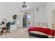 This bright bedroom features a door to the balcony, a ceiling fan and a built-in vanity at 4100 Albion St # 314, Denver, CO 80216