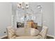 Light and bright dining room featuring a chandelier and seating for four guests at 4100 Albion St # 314, Denver, CO 80216