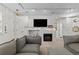 Relaxing living room with a decorative fireplace and an entertainment area at 4100 Albion St # 314, Denver, CO 80216