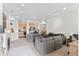 Spacious living room with neutral colors, fireplace and an open view of the kitchen at 4100 Albion St # 314, Denver, CO 80216