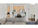 Cozy living space showcasing an open layout with a view to the kitchen at 4100 Albion St # 314, Denver, CO 80216