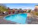 Resort-style community pool with ample lounge chairs and well-maintained landscaping at 4100 Albion St # 314, Denver, CO 80216
