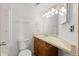 Bathroom with a toilet, vanity, sink, mirror, and shower-tub combination at 8701 Huron St # 5-210, Thornton, CO 80260