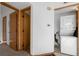 Hallway with a stacked washer and dryer and two closets at 8701 Huron St # 5-210, Thornton, CO 80260