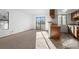 Sun-filled living room featuring an open layout and kitchen passthrough at 8701 Huron St # 5-210, Thornton, CO 80260