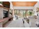 Bright living room featuring a brick fireplace, sliding glass doors, and neutral decor at 2386 Daisy Ln, Golden, CO 80401