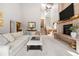 Spacious living room boasting high ceilings, a brick fireplace, and tons of natural light at 2386 Daisy Ln, Golden, CO 80401