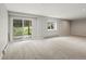 Finished basement with sliding glass doors leading to a patio and backyard at 20125 Indi Dr, Monument, CO 80132