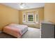 Bedroom with a bay window, ceiling fan, carpet, and a neutral color palette at 20125 Indi Dr, Monument, CO 80132