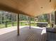 Spacious outdoor deck with ample seating overlooking a wooded area, perfect for entertaining at 20125 Indi Dr, Monument, CO 80132