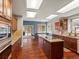 Kitchen with wood floors, stainless appliances, granite counters, and access to outside patio at 20125 Indi Dr, Monument, CO 80132