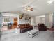 Open-concept living room with vaulted ceilings, natural light, and leather furniture at 20125 Indi Dr, Monument, CO 80132