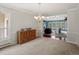 Bright dining area with hardwood floors that leads to the living room with a fireplace at 20125 Indi Dr, Monument, CO 80132