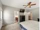 Spacious main bedroom with ensuite bathroom, ceiling fan, walk in closet, and exterior access at 20125 Indi Dr, Monument, CO 80132