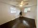 Bright bedroom with dark wood floors, windows and ceiling fan at 1088 Douglas Dr, Denver, CO 80221