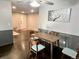Bright dining area with stylish table set, wainscoting and modern lighting at 1088 Douglas Dr, Denver, CO 80221