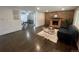 Open-concept living room featuring a fireplace and adjacent dining area at 1088 Douglas Dr, Denver, CO 80221