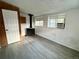 Finished basement space with vinyl flooring and updated windows, suitable for recreation or storage at 1088 Douglas Dr, Denver, CO 80221