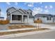 Beautiful two-story home with a two-car garage and a covered front porch entrance at 9996 Racine St, Commerce City, CO 80022